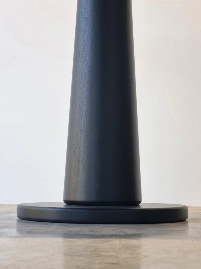 Majestic Cellar Table in ebonised Jarrah, close-up detail of tapered leg and base - Nathan Day Design