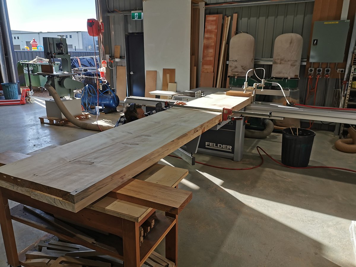 Scorched Buffet in scorched Norfolk Island Pine, raw timber board being milled in workshop - Nathan Day Design