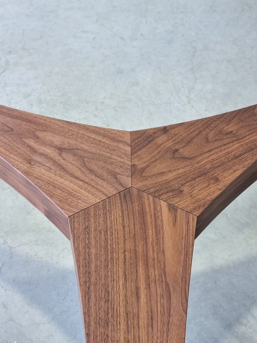 Close-up of the Wende Coffee Table's stack-laminated leg joinery in American Walnut - handcrafted bespoke furniture, Nathan Day Design