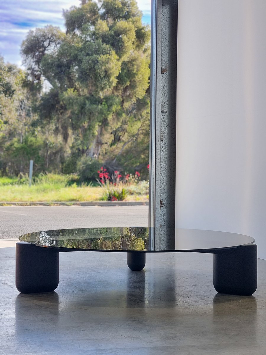 Hippo Coffee Table styled outdoors near Willyabrup, Western Australia - bespoke ebonised jarrah and grey glass coffee table by Nathan Day Design