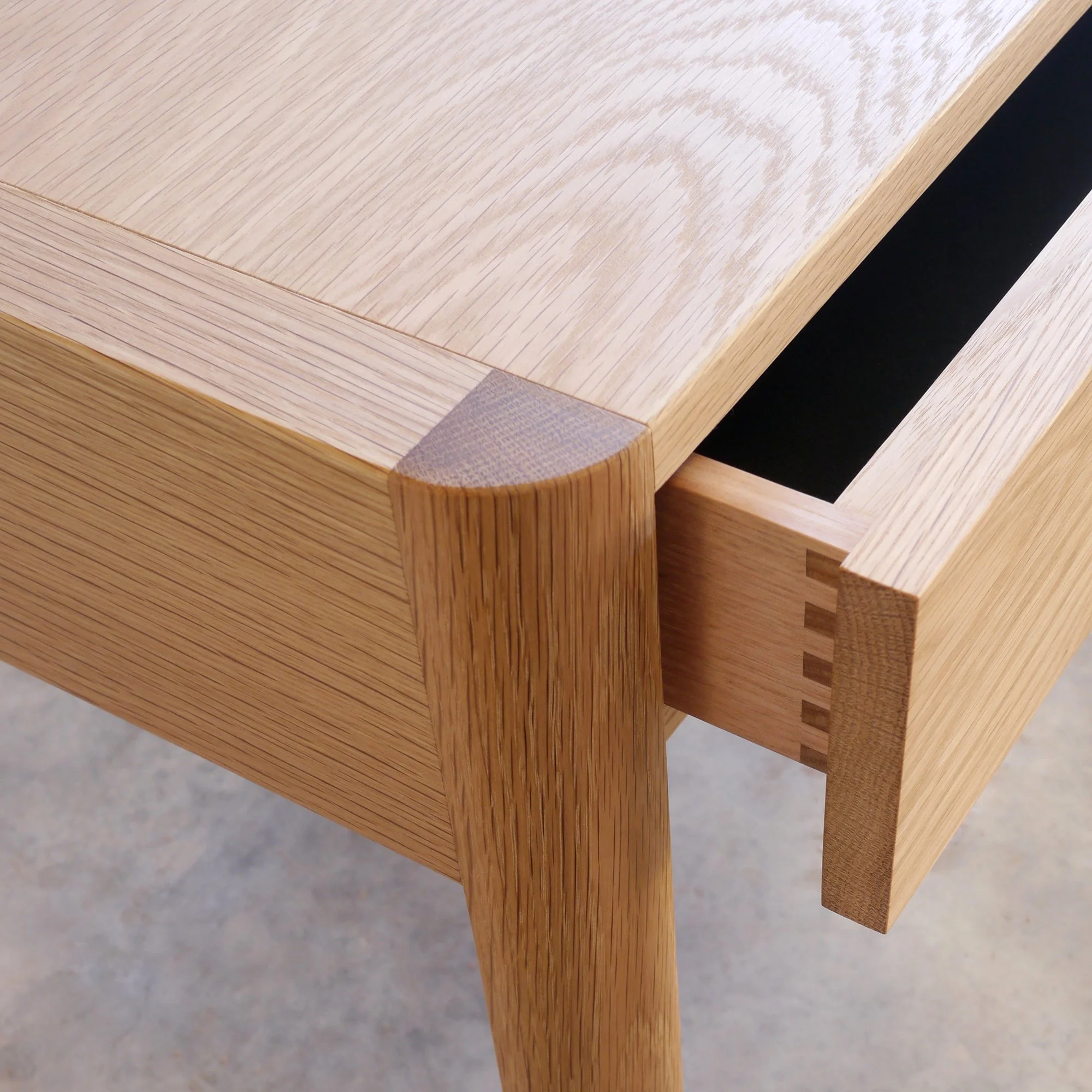 Hampden Bedside Table in Oak - Nathan Day Design, close-up of leg and dovetail drawer joinery detail