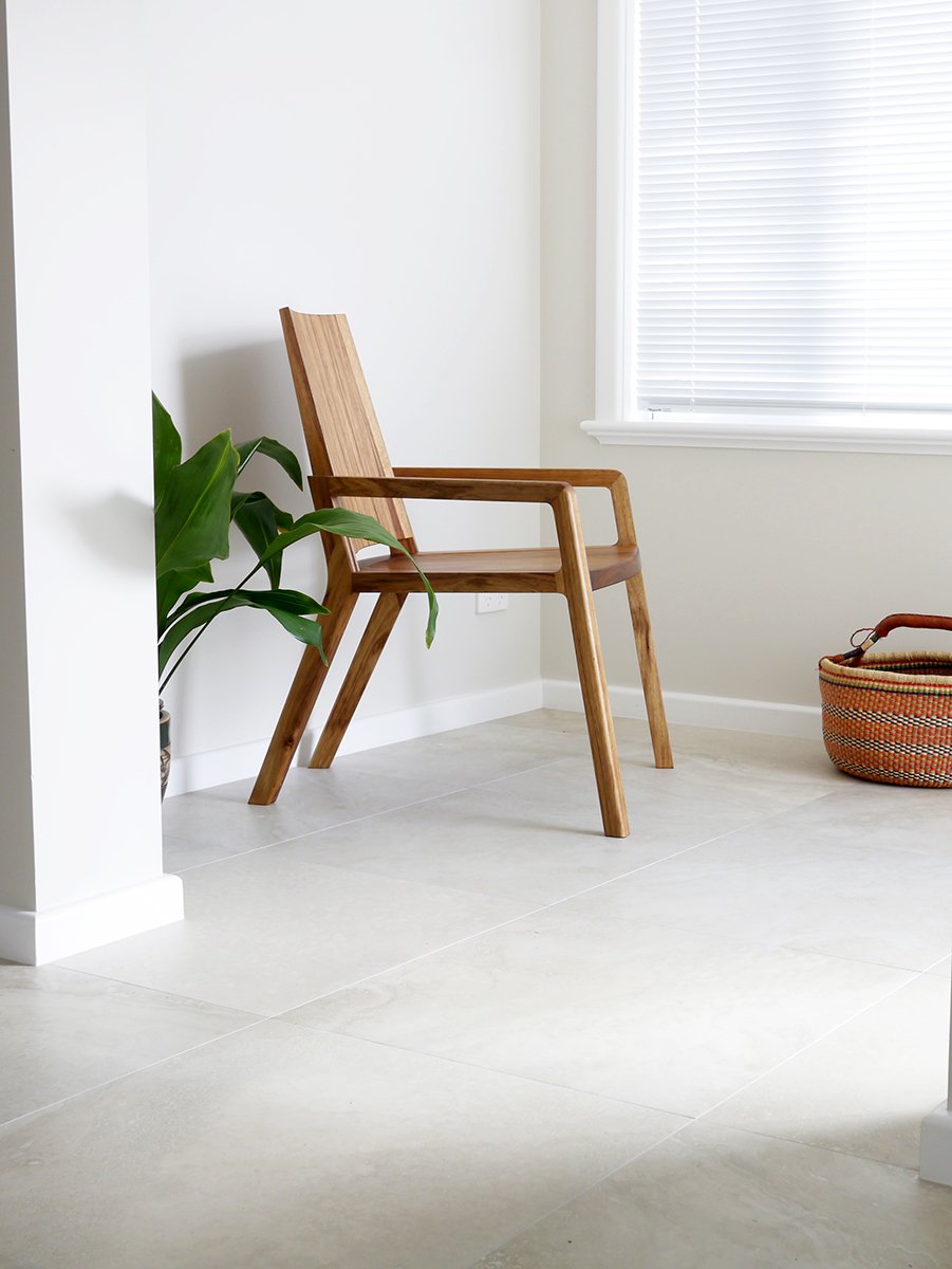 Uluru Chair in Otways Blackwood, Nathan Day Design bespoke furniture - lifestyle setting near window with plant
