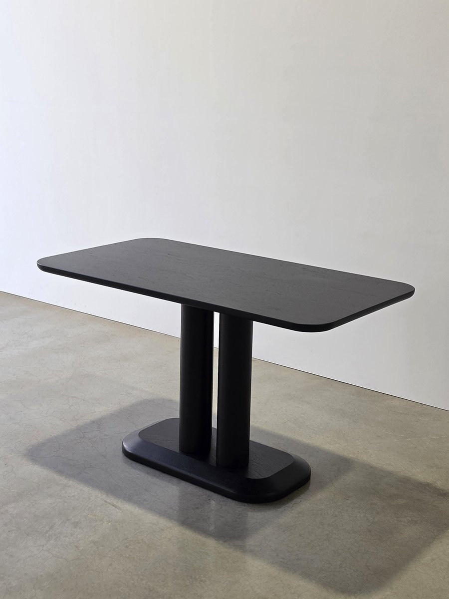 Coop Nook Table from an angle where only two of its three legs appear visible - Nathan Day Design