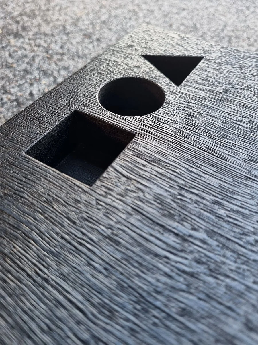 DIA Awards Trophies in scorched Jarrah - Nathan Day Design, close-up of cut-out circle, triangle and square detail