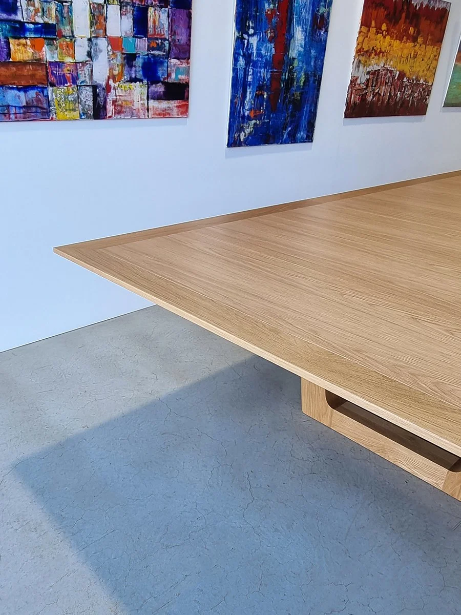 Rhodes House Boardroom Table in American Oak, trestle base design - Nathan Day Design, overhead diagonal close-up of tabletop grain
