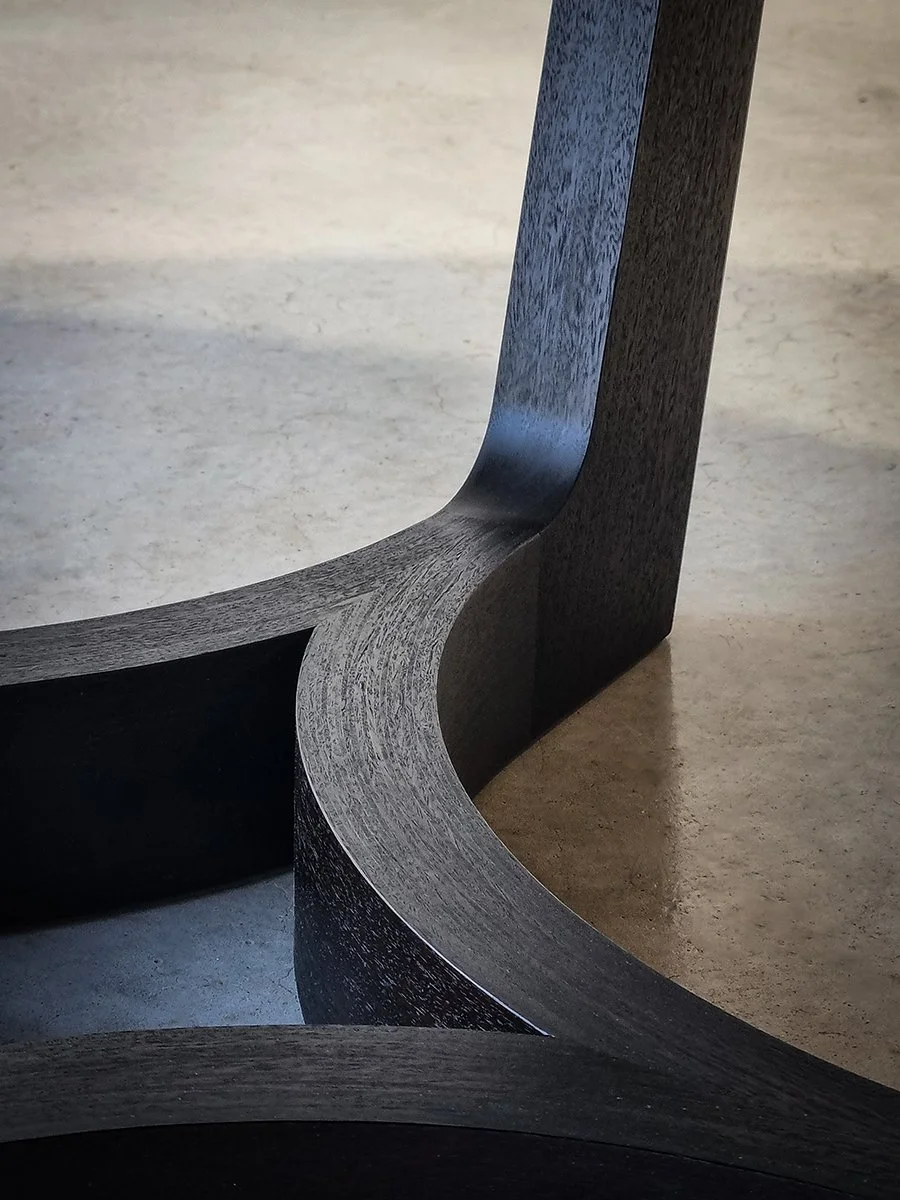 Close-up of the Froxfield Table's ebonised Jarrah base showing the smooth curved joinery - Nathan Day Design