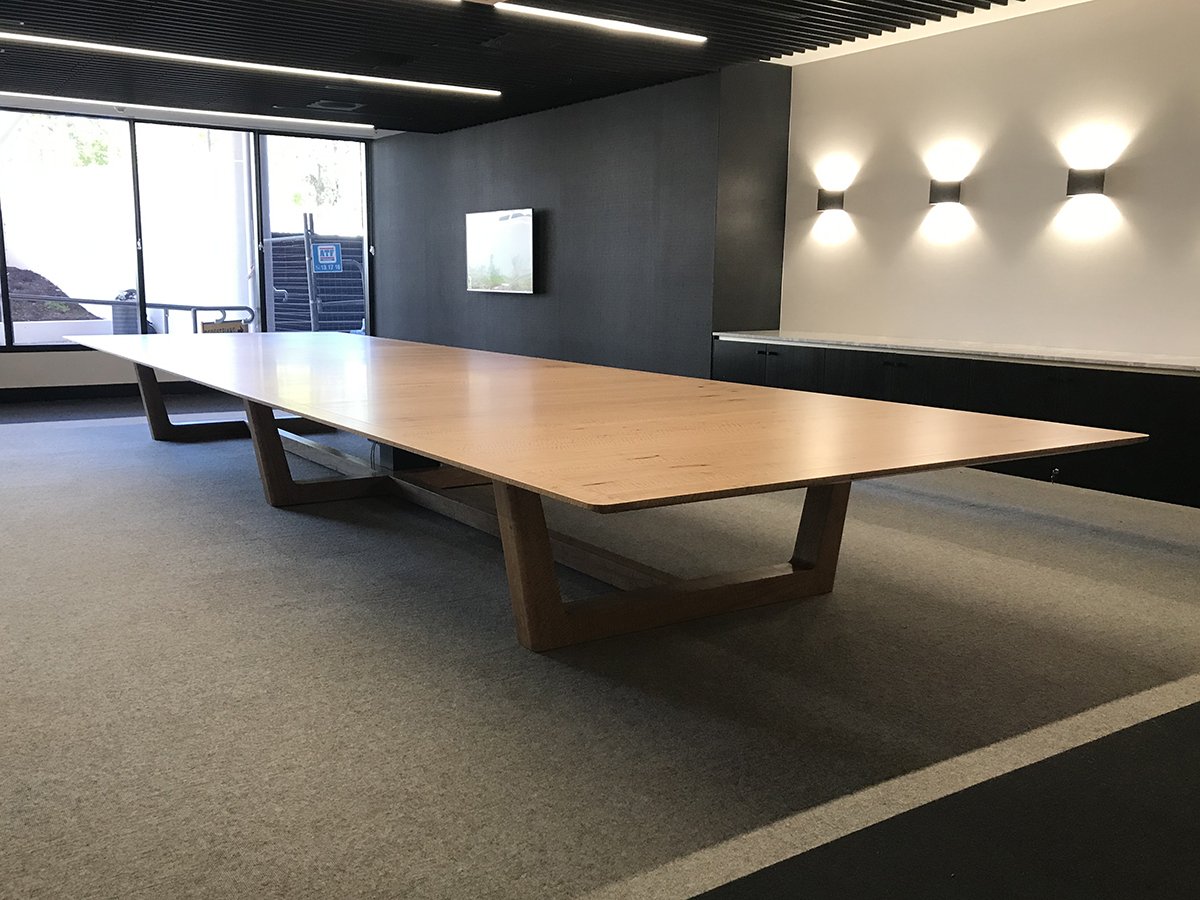 DWER custom furniture in WA Blackbutt - Nathan Day Design, long empty boardroom table with trestle base under feature lighting