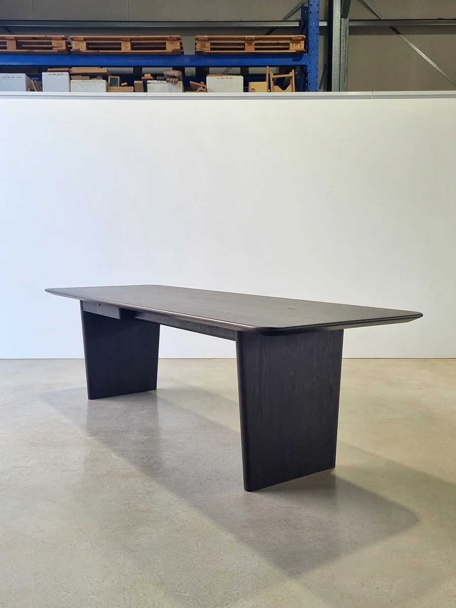 Morey Desk in ebonised Jarrah, panel-leg design, full front view in workshop - Nathan Day Design