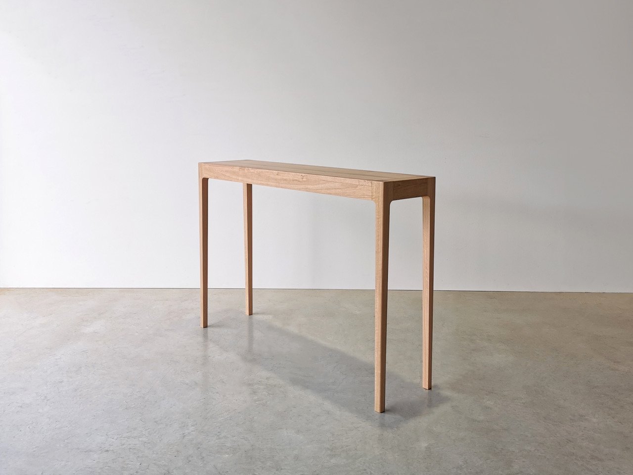 Louis Console in WA Blackbutt, full front view in natural finish, studio setting - Nathan Day Design