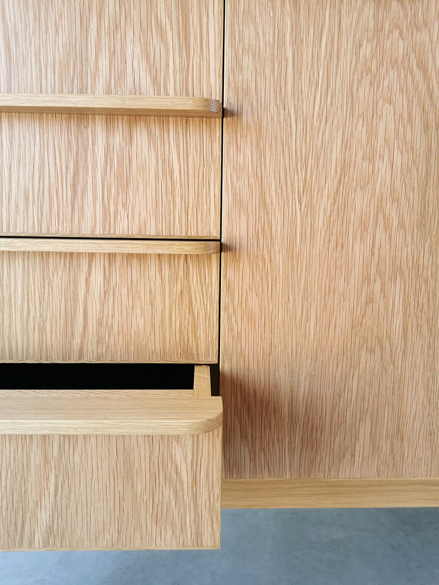 Wembley House Credenza in American Oak, angled corner detail with drawer open showing lined interior - Nathan Day Design
