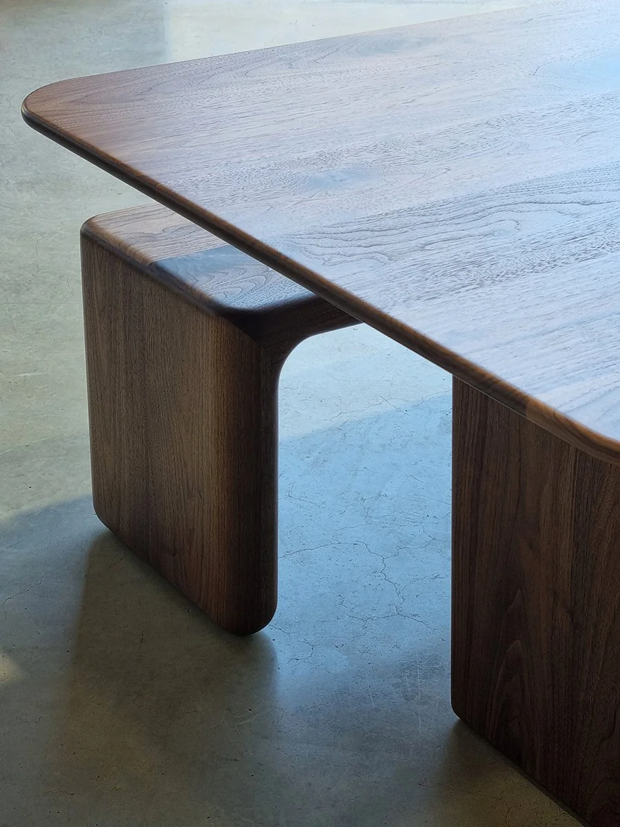 Detail of the Morey Table's softened corner profile and Walnut slab leg - Nathan Day Design