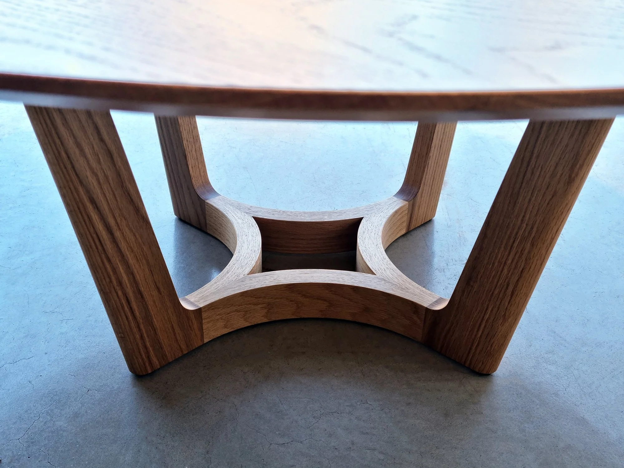 Underside view of the Froxfield Coffee Table's dynamic angled leg structure - bespoke furniture by Nathan Day Design