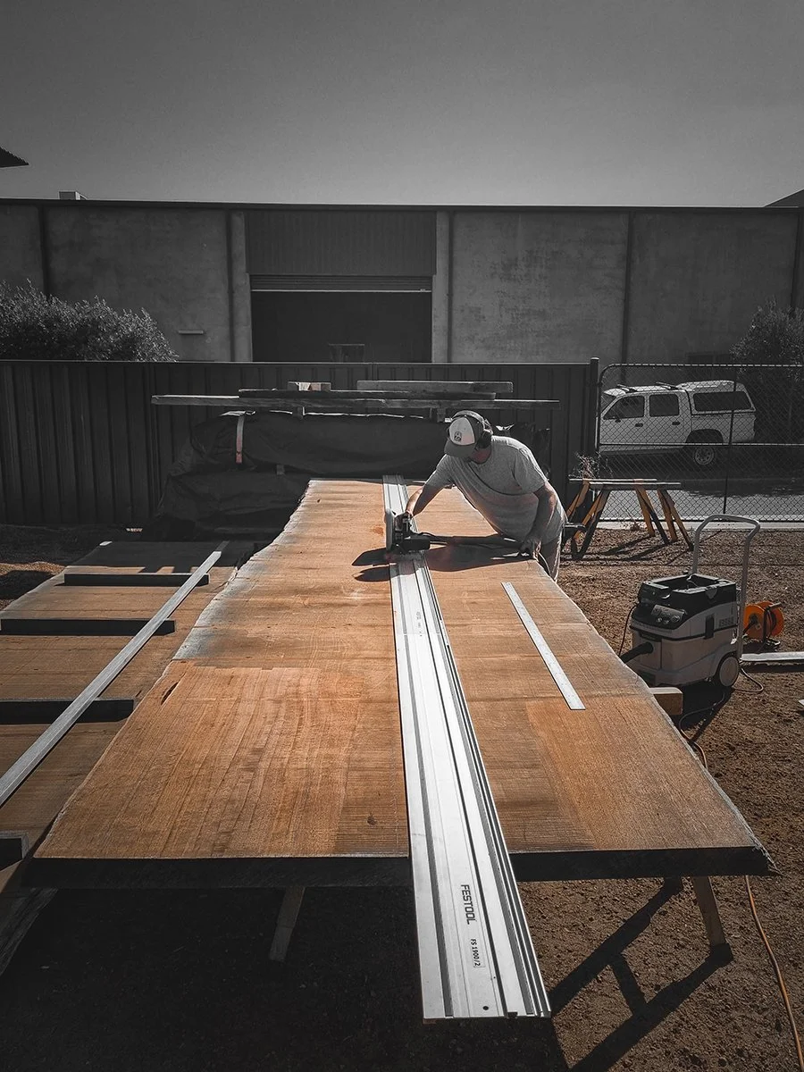 Nathan Day cutting the raw 6 metre ancient Jarrah slab that would become the Como Table