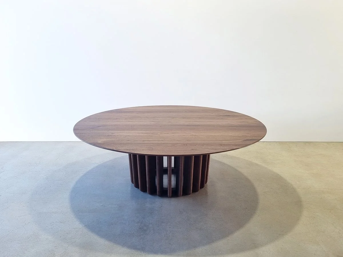 Straight-on view of the Lantern Table's evenly spaced Walnut fins and dramatic shadow pattern - Nathan Day Design