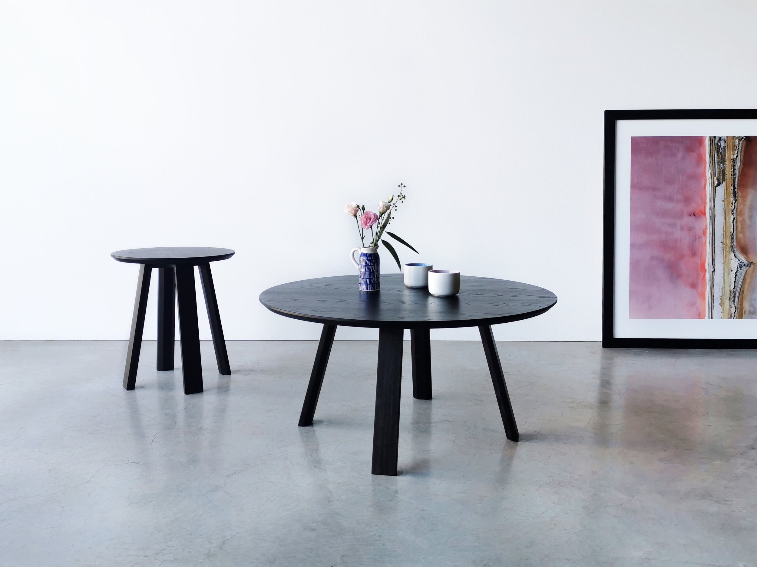 Wonton Coffee Table in ebonised Oak with matching side table, styled with flowers and framed art - Nathan Day Design