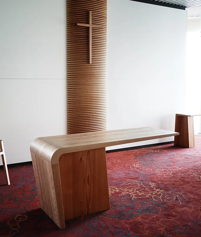St John Midland Liturgical Furniture in salvaged Oregon Pine - Nathan Day Design, altar table with waterfall-edge legs against fluted cross wall