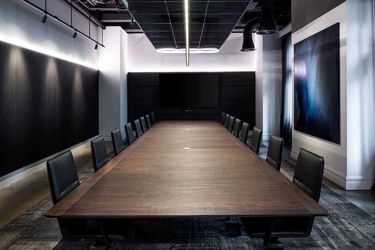 Woods Bagot Boardroom Table in ebonised Jarrah - Nathan Day Design, straight-on view down length of table facing display screens