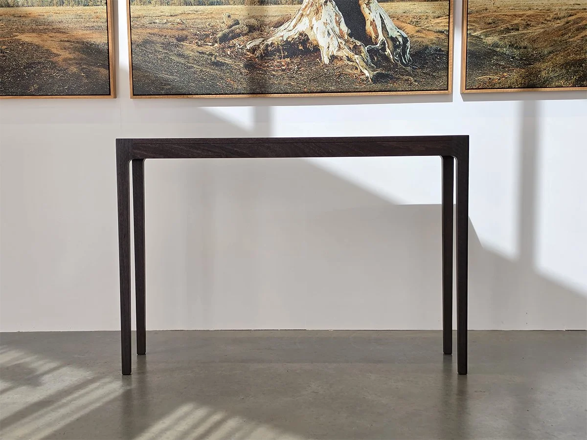 Louis Console in WA Blackbutt, ebonised finish wide-angle view in gallery setting - Nathan Day Design