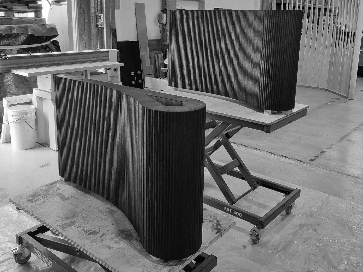 Fluted timber table panels being hand-fabricated in the Nathan Day Design workshop during production