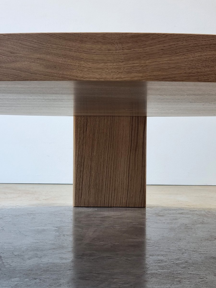Close-up of the Quindi Coffee Table's solid French Oak pedestal leg - handcrafted bespoke furniture, Nathan Day Design