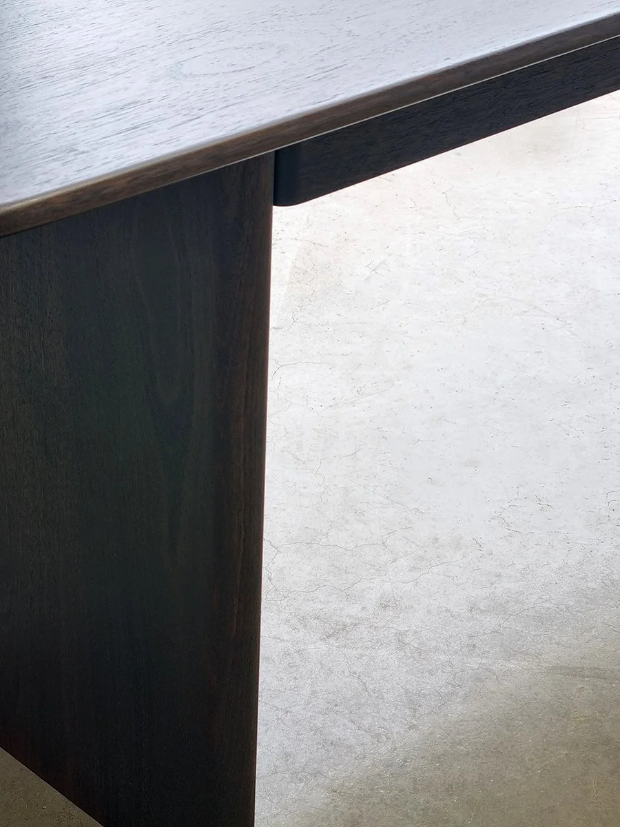 Morey Desk in ebonised Jarrah, close-up angled leg and top edge detail - Nathan Day Design