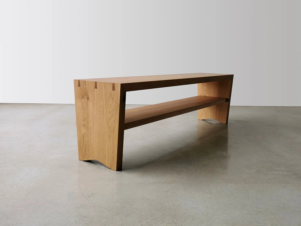 Dovetail Bench in American Oak with exposed dovetail joinery, Nathan Day Design - low angle view near entryway