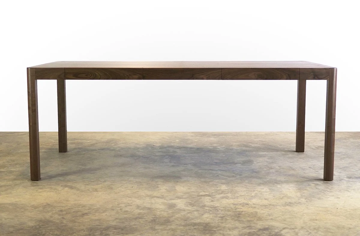 Irvine Desk in Walnut, minimalist frame-leg design - Nathan Day Design, full front view in studio setting