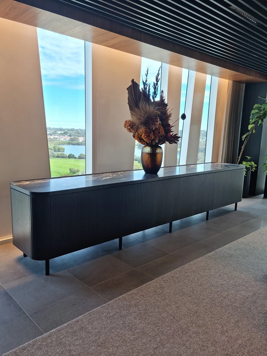 Walters Boardroom Credenza in ebonised American Walnut, installed in boardroom with floor-to-ceiling windows - Nathan Day Design