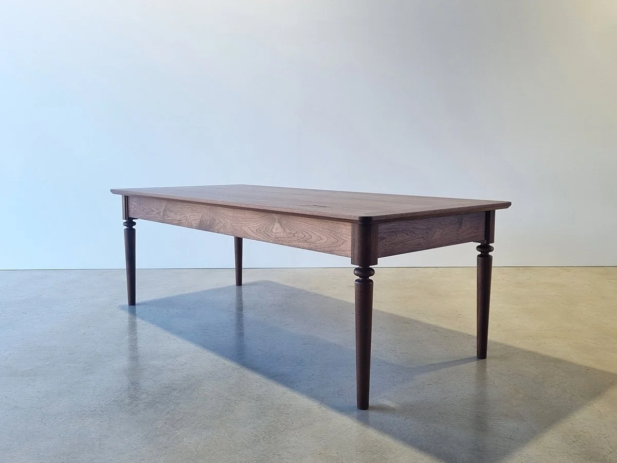 Boundary Lane Desk in American Walnut, full front view against plain studio wall - Nathan Day Design