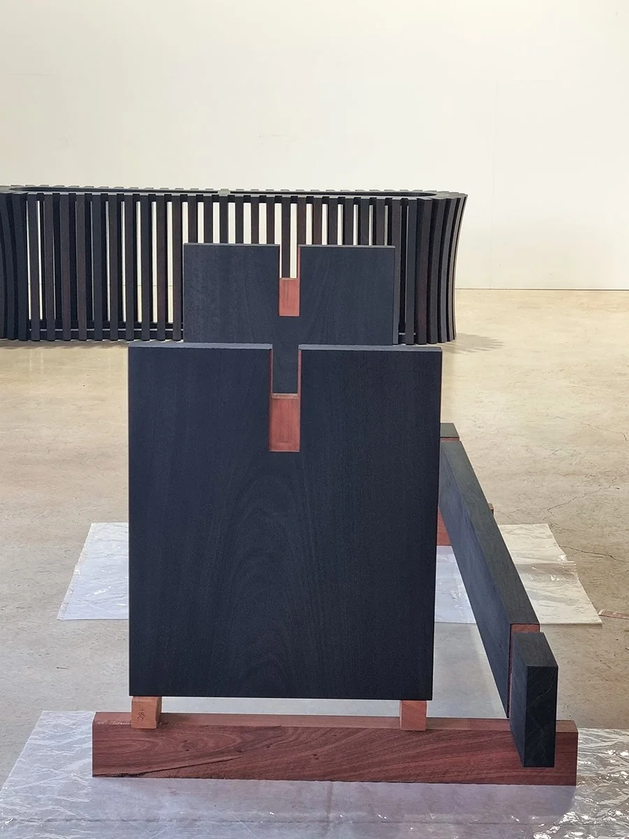 Workshop joinery test-assembly for the Como Table's leg-to-frame construction with contrasting timber accents