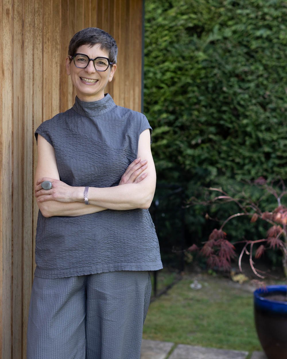 acupuncturist Kerstin Lehr smiling outside treatment room