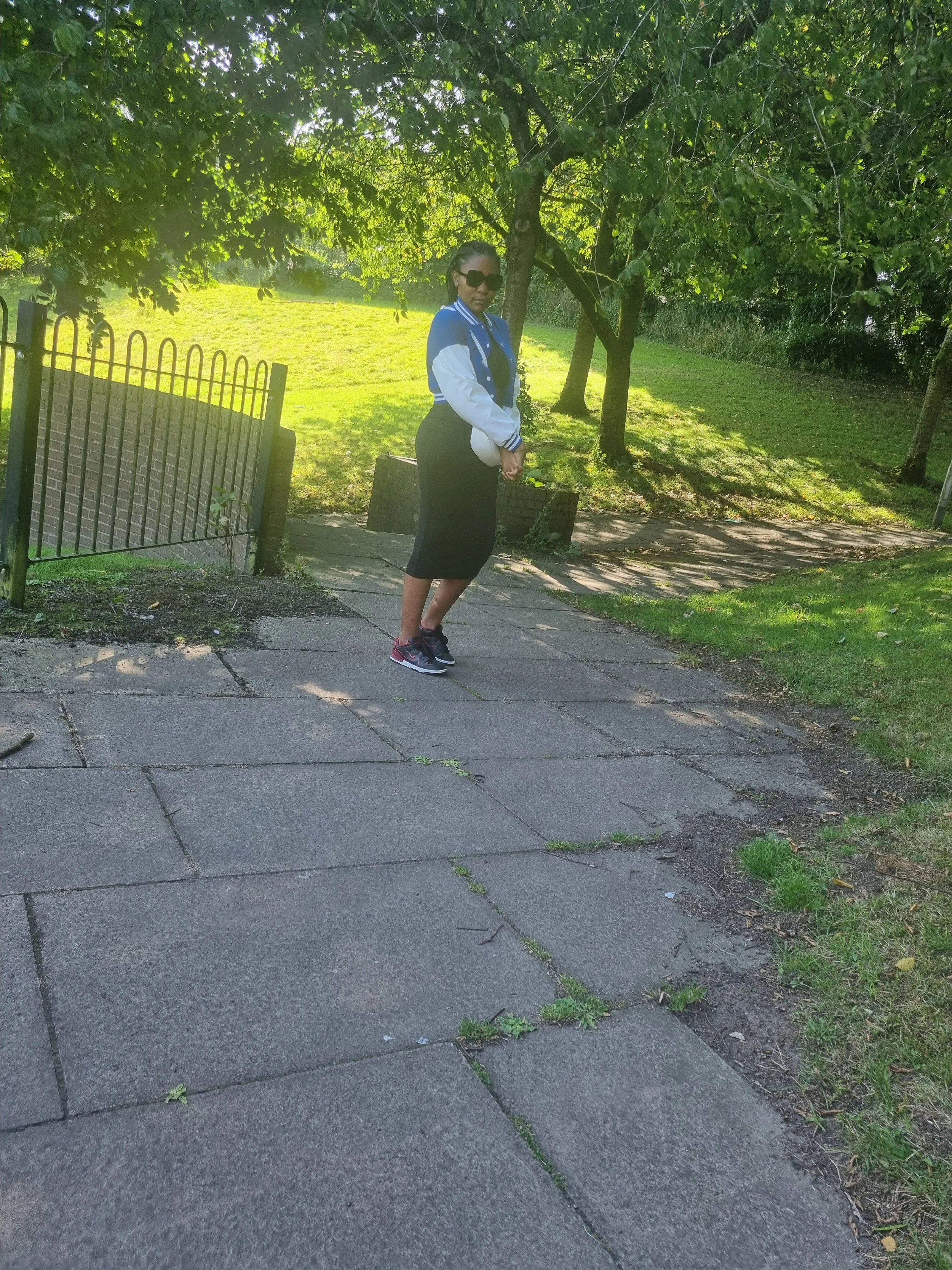 Director of Favourcare Digital Help CIC standing outdoors, representing leadership in digital support for immigrants and vulnerable adults.