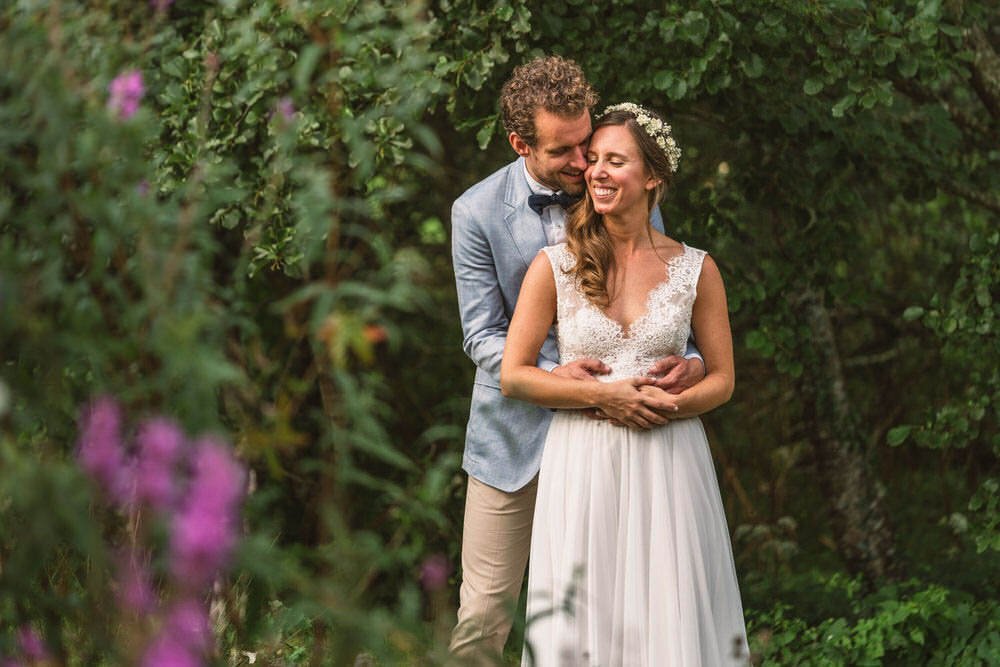 bride and groom portrait in apple orchard