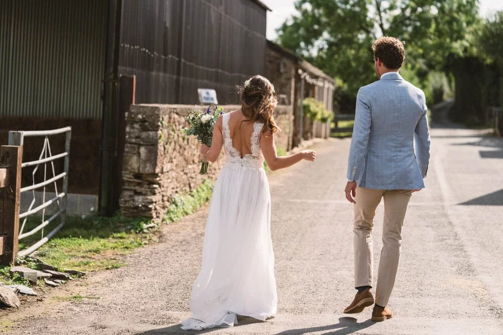 Walking bride and groom at Anran Farm wedding
