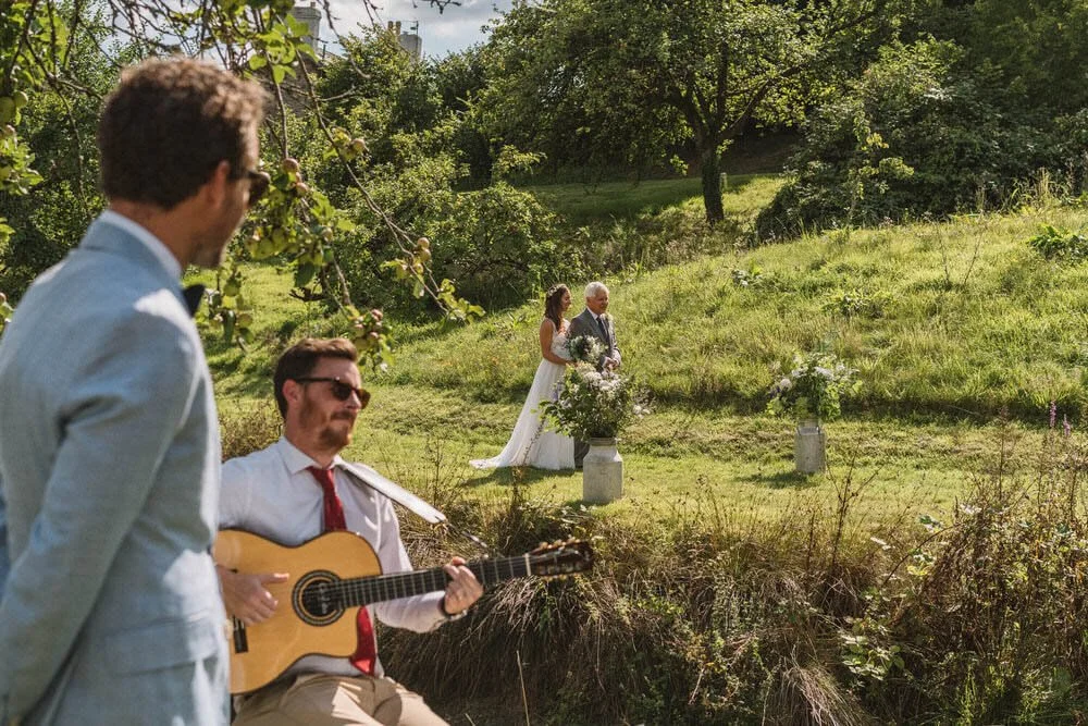 Bride entrance with guitar player