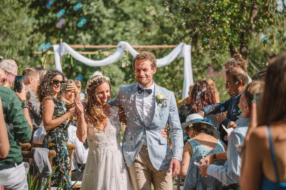 Bride and groom exit outdoor ceremony