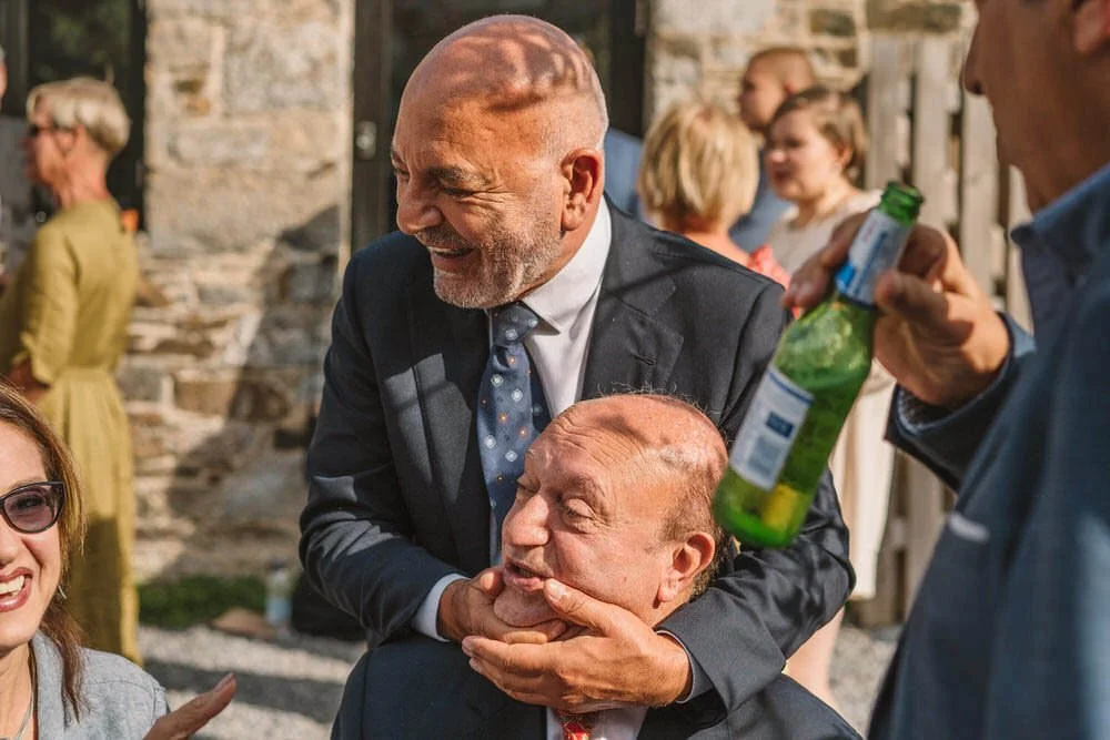 Wedding guests having fun in courtyard