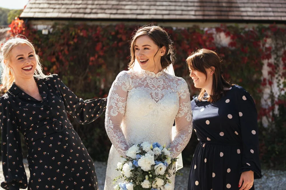 Bridesmaid laughing with friends