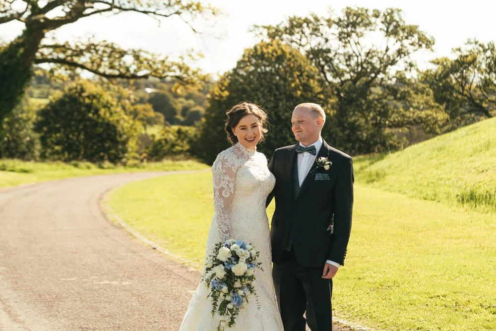 Bride and groom outside the Glass House. 