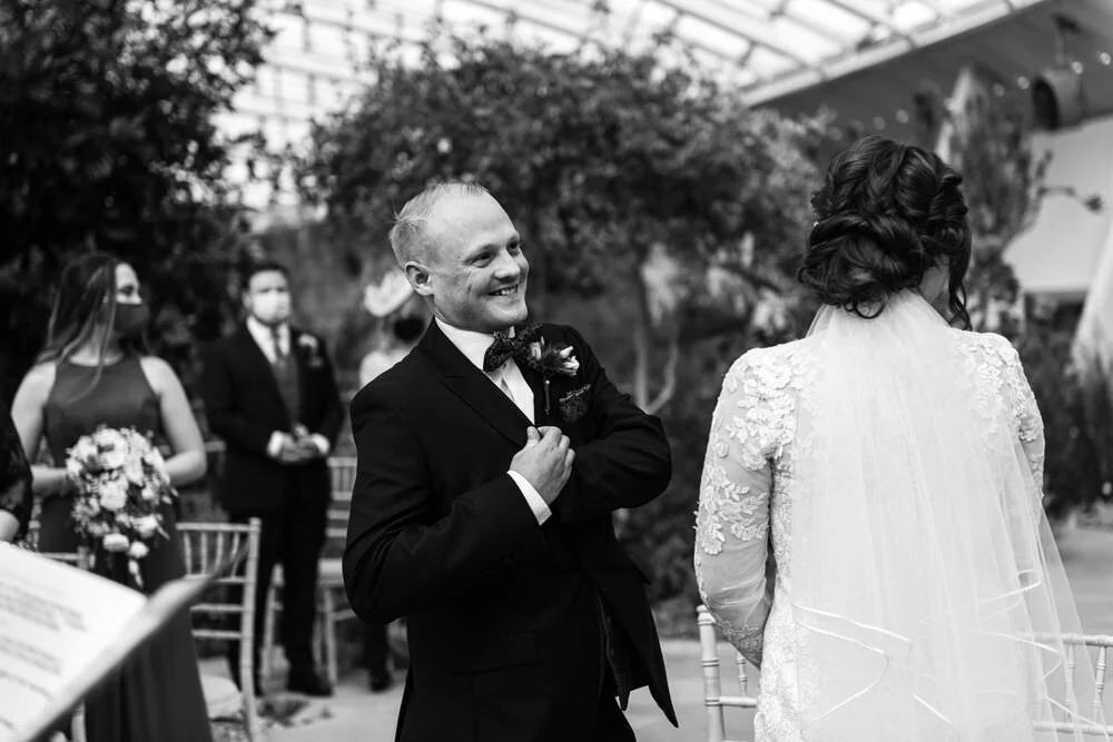 Groom laughing during ceremony