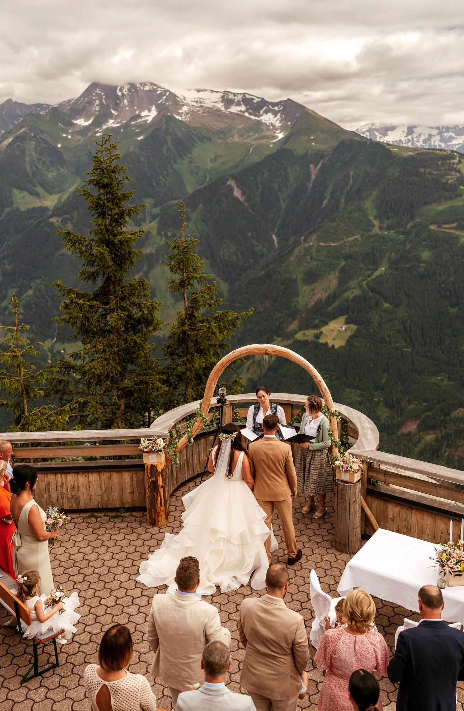 A couple getting married with a panoramic view in front of them in the Austria Penken Mountains.