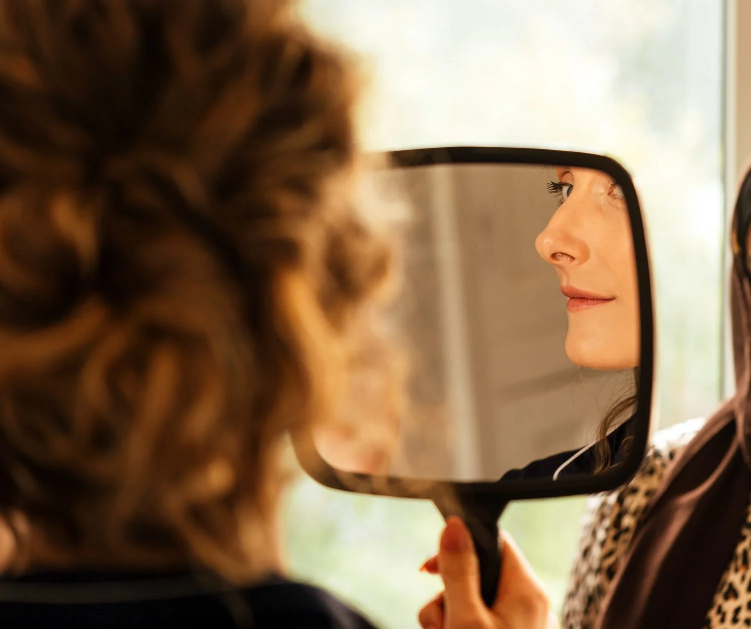 Bride in handheld mirror-Swansea-wedding-photographers-Morgans-Hotel-South-Wales-Videogrraphy- (4).jpg