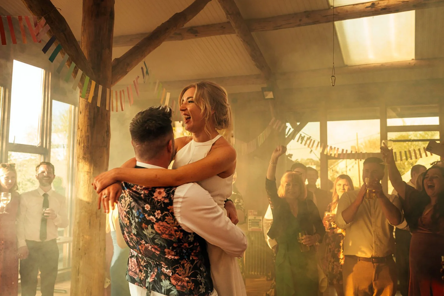 groom lifting bride