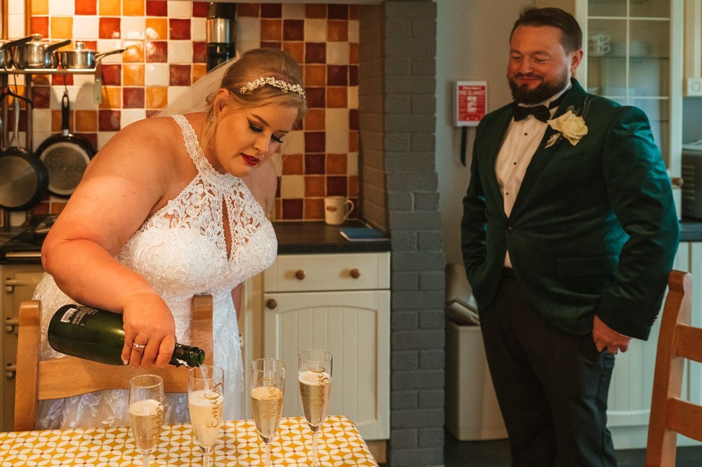 Bride pouring champagne