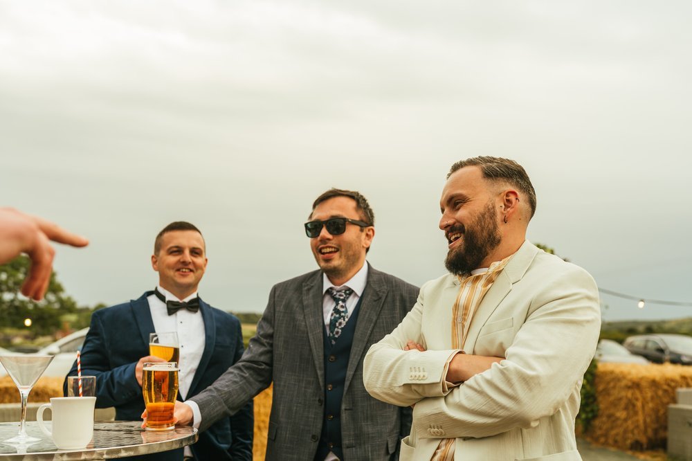 Candid wedding guests outside