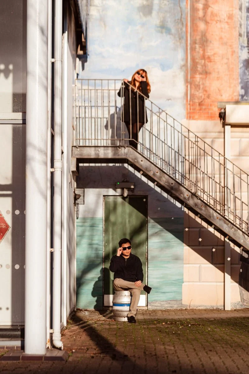 Engaged Asian couple in an urban Swansea marina having their pre wedding photo shoot in the sunshine.