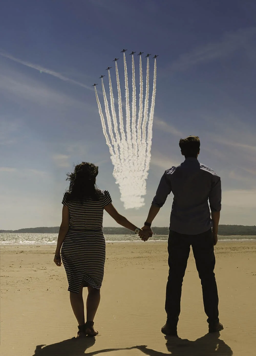Engagement photos on Swansea beach with the red arrows flying over.