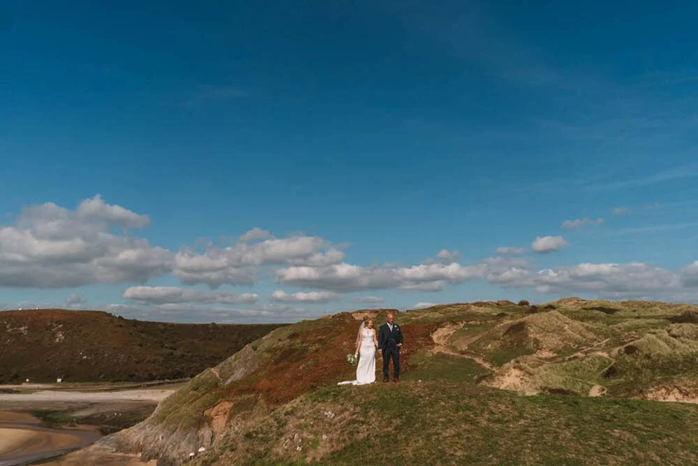 Wedding couple of top of Three Cliffs