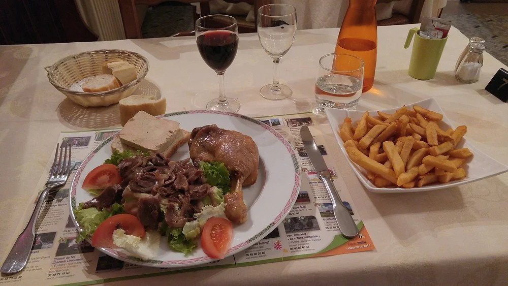 A three-course duck dinner of foie gras, duck gizzard salad and duck confit at the Hôtel Mère Michelet restaurant in Confolens, France.