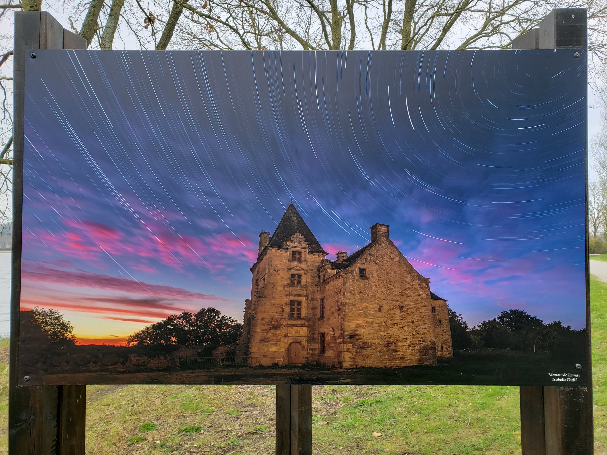 Manoir de Lemay, an outdoor artwork by artist Isabelle Dufil, displayed along the trails bordering Lac au Duc in Ploërmel, France, part of an outdoor art exhibition in the Breton countryside.